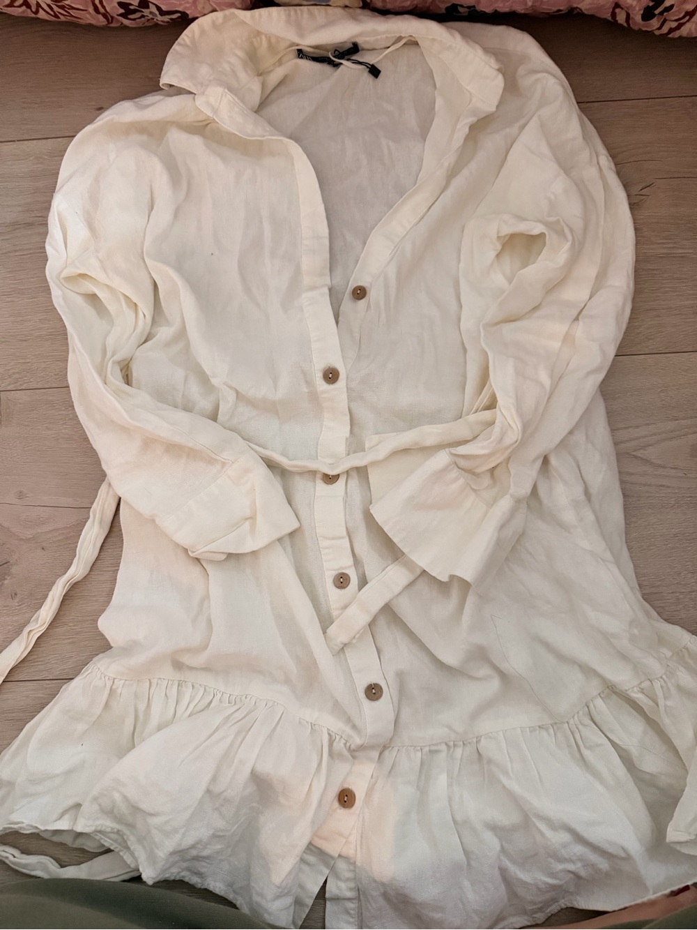 Linen Cream Button-Front Ruffle Hem Tunic